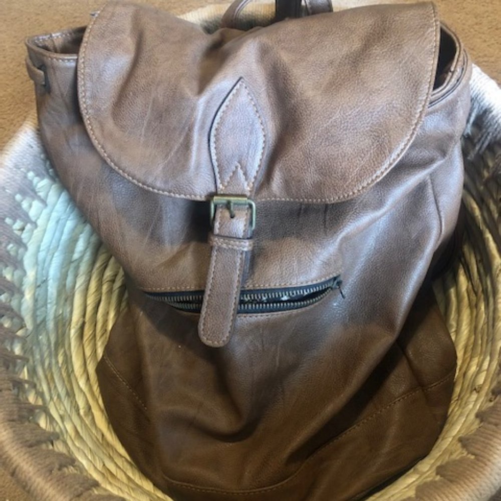 Large Backpack Brown with Floral inside.